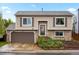 Charming two-story home with a brick facade and a well-maintained front yard in a suburban neighborhood at 3312 Meadow Ave, Broomfield, CO 80020