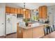 Cozy kitchen with wooden cabinets, white countertops, and stainless steel appliances at 3312 Meadow Ave, Broomfield, CO 80020