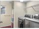 Convenient laundry room featuring modern washer and dryer, with ample storage at 3312 Meadow Ave, Broomfield, CO 80020