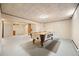 Finished basement featuring paneled walls, tile ceiling, recessed lighting, and a pool table at 1487 W Fair Ave, Littleton, CO 80120