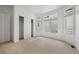 Bedroom with light colored carpet, windows, and closet at 5322 Shetland Ct, Highlands Ranch, CO 80130