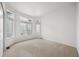 Empty bedroom with natural light from bay windows and neutral carpeting at 5322 Shetland Ct, Highlands Ranch, CO 80130
