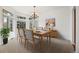 Formal dining room with large windows, a chandelier, and seating for six at 5322 Shetland Ct, Highlands Ranch, CO 80130