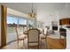 Dining room with chandelier and a view of the living room, and kitchen at 5322 Shetland Ct, Highlands Ranch, CO 80130