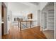 Bright entryway showcasing hardwood floors, open staircase, and access to living spaces at 5322 Shetland Ct, Highlands Ranch, CO 80130