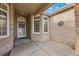 Inviting front porch with decorative windows and a stylish front door at 5322 Shetland Ct, Highlands Ranch, CO 80130