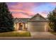 Beautiful single-Gathering home with warm exterior colors, a well-maintained lawn, and a two-car garage at 5322 Shetland Ct, Highlands Ranch, CO 80130