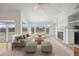 Bright living room featuring vaulted ceilings, a fireplace, and large windows providing ample natural light at 5322 Shetland Ct, Highlands Ranch, CO 80130