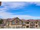 Community view shows building exteriors and mountain backdrop at 11932 W Long Cir # 201, Littleton, CO 80127