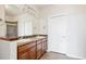Double vanity bathroom with shower and tile flooring at 11932 W Long Cir # 201, Littleton, CO 80127
