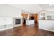 Open concept kitchen and living area with hardwood floors and island at 11932 W Long Cir # 201, Littleton, CO 80127