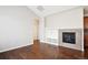 Living room with hardwood floors and a gas fireplace at 11932 W Long Cir # 201, Littleton, CO 80127
