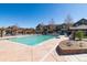 Inviting community swimming pool with surrounding patio at 11932 W Long Cir # 201, Littleton, CO 80127