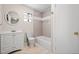 Clean bathroom with a bathtub and updated vanity at 1876 S Chester Cir, Denver, CO 80247