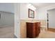 Bathroom with vintage vanity, tile flooring, and a toilet at 1876 S Chester Cir, Denver, CO 80247