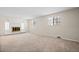 Spacious living room with fireplace and carpet flooring at 1876 S Chester Cir, Denver, CO 80247