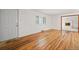 Living room featuring hardwood floors and view of entryway at 1876 S Chester Cir, Denver, CO 80247