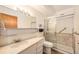 Bathroom with shower, toilet and vanity with a large mirror at 300 S Clinton St # 10C, Denver, CO 80247