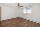 Bedroom with laminate flooring, ceiling fan, and window with a view at 300 S Clinton St # 10C, Denver, CO 80247