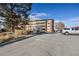 Building exterior showing parking and landscaping at 300 S Clinton St # 10C, Denver, CO 80247