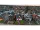 Aerial view of charming home with a red door, manicured lawn, and beautiful neighborhood surroundings at 2767 W 38Th Ave, Denver, CO 80211