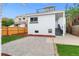 Back exterior of home with a rooftop deck, and a well-kept yard with pavers and grass at 2767 W 38Th Ave, Denver, CO 80211