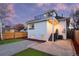 Backyard featuring a patio, stairs to an upper balcony, and a fenced-in yard at 2767 W 38Th Ave, Denver, CO 80211