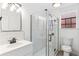 Bathroom features glass enclosed shower, modern fixtures, and stylish tile at 2767 W 38Th Ave, Denver, CO 80211