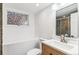 Modern bathroom features stylish vanity, tiled shower, updated window, and fresh paint at 2767 W 38Th Ave, Denver, CO 80211
