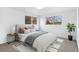 Staged bedroom with queen bed, side tables, and modern decor at 2767 W 38Th Ave, Denver, CO 80211