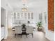 Dining area featuring white cabinets, a table with chairs, and natural light at 2767 W 38Th Ave, Denver, CO 80211