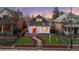 Charming single-Gathering home with a red door, manicured lawn, and decorative rock landscaping at 2767 W 38Th Ave, Denver, CO 80211