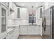 Modern kitchen features stainless steel appliances and sleek white cabinetry at 2767 W 38Th Ave, Denver, CO 80211