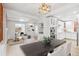 Open-concept with a large dining table adjoining to a modern kitchen and living room at 2767 W 38Th Ave, Denver, CO 80211