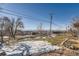 Backyard with snow, landscaping, and mountain views at 5421 S Sherman St, Littleton, CO 80121