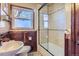 Updated bathroom with tiled shower and pedestal sink at 5421 S Sherman St, Littleton, CO 80121