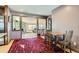 Small dining area with rustic table and chairs, adjacent to a stone fireplace at 5421 S Sherman St, Littleton, CO 80121