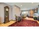 Bright dining area with a small table and chairs, and a grandfather clock at 5421 S Sherman St, Littleton, CO 80121