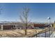 View of school with basketball court and mountain backdrop at 5421 S Sherman St, Littleton, CO 80121