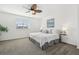 Bright bedroom with a ceiling fan, carpet, and a window with natural light at 19844 E Vassar Ave, Aurora, CO 80013