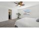 Bright bedroom with a ceiling fan, carpet, and a window with natural light at 19844 E Vassar Ave, Aurora, CO 80013