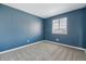 This bedroom features nice grey carpet and neutral blue painted walls at 19844 E Vassar Ave, Aurora, CO 80013