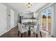 Well-lit dining area with sliding glass doors, opening to a full view of backyard at 19844 E Vassar Ave, Aurora, CO 80013