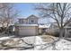 Charming two-story home with a two-car garage, and a well-maintained front yard at 19844 E Vassar Ave, Aurora, CO 80013