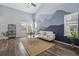 Comfortable living room featuring a mountain mural and a ceiling fan for added comfort at 19844 E Vassar Ave, Aurora, CO 80013