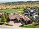 Breathtaking aerial view of the home on a golf course with mountain views at 7188 Raphael Ln, Littleton, CO 80125