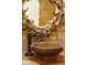 Bathroom vanity with decorative mirror and bowl sink at 7188 Raphael Ln, Littleton, CO 80125