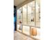 Elegant display shelves with glass shelves, lighting, and decorative items at 7188 Raphael Ln, Littleton, CO 80125