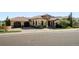 Beautiful home with a tile roof, stone accents, and a circular driveway at 7188 Raphael Ln, Littleton, CO 80125