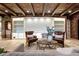 Inviting living area with seating, built-in shelves, and a decorative ceiling at 7188 Raphael Ln, Littleton, CO 80125